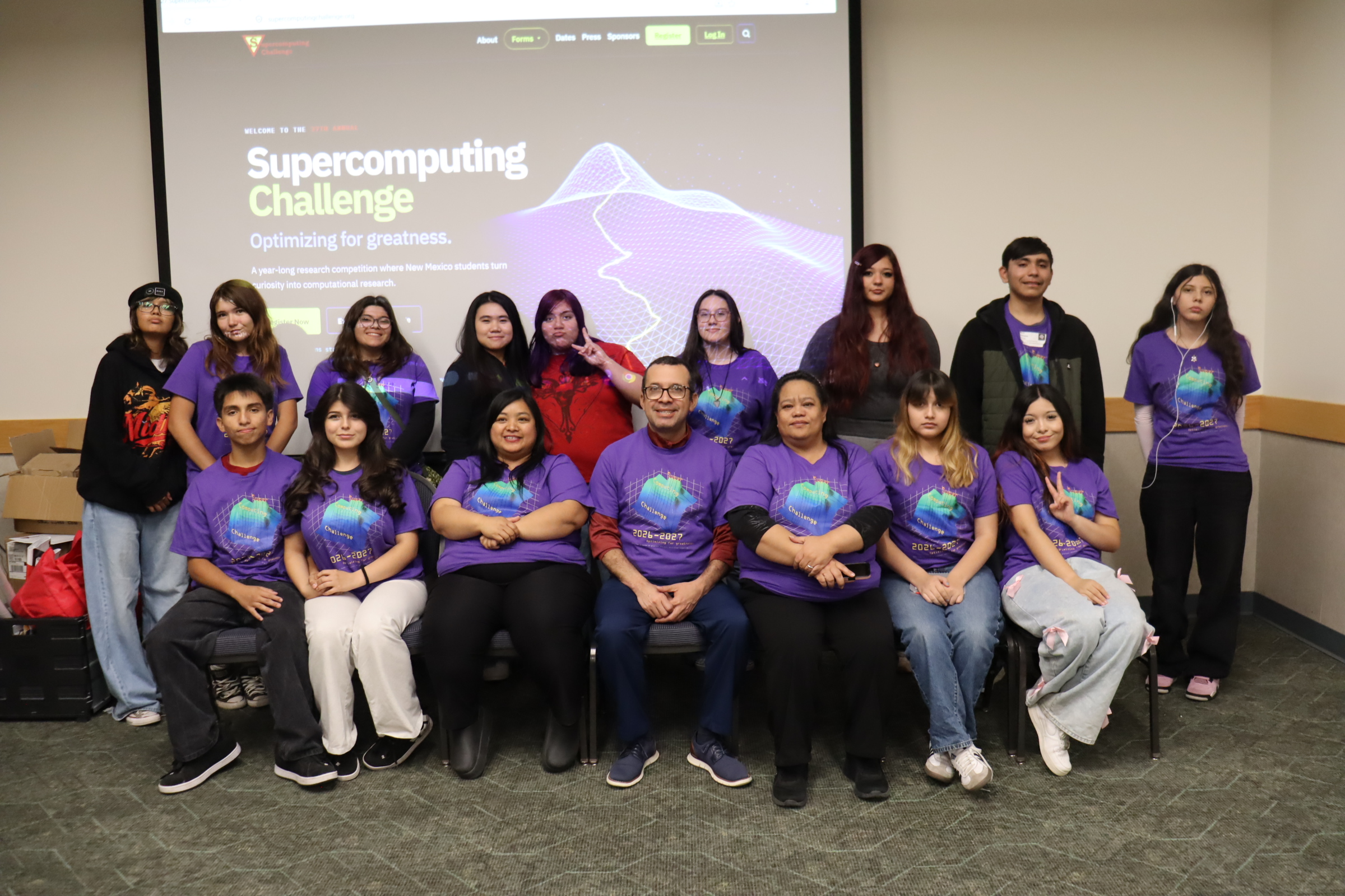 A school team posed in front of the Challenge welcome screen