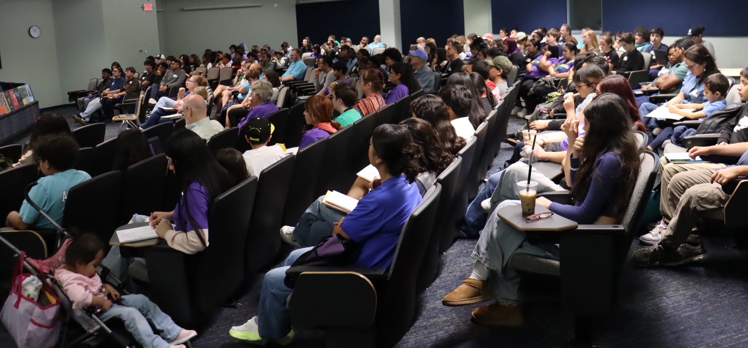 Students and adults seated in the Kickoff auditorium