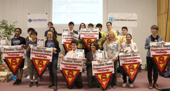 Supercomputing Challenge finalists holding team banners
