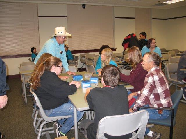 Students discuss their projects with volunteer scientists